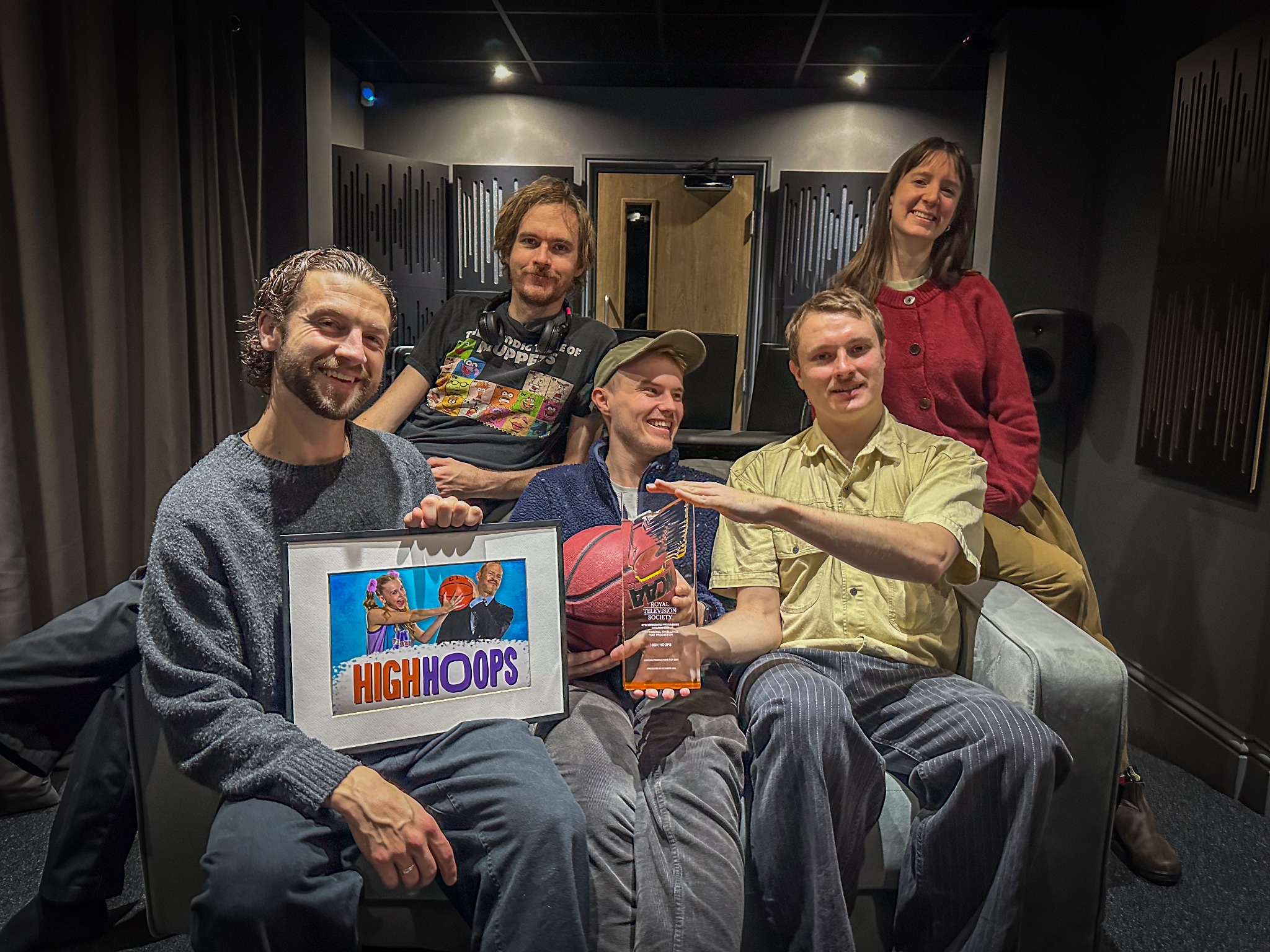 The Motion Post Production team together in the studio with their Royal Television Society award for High Hoops